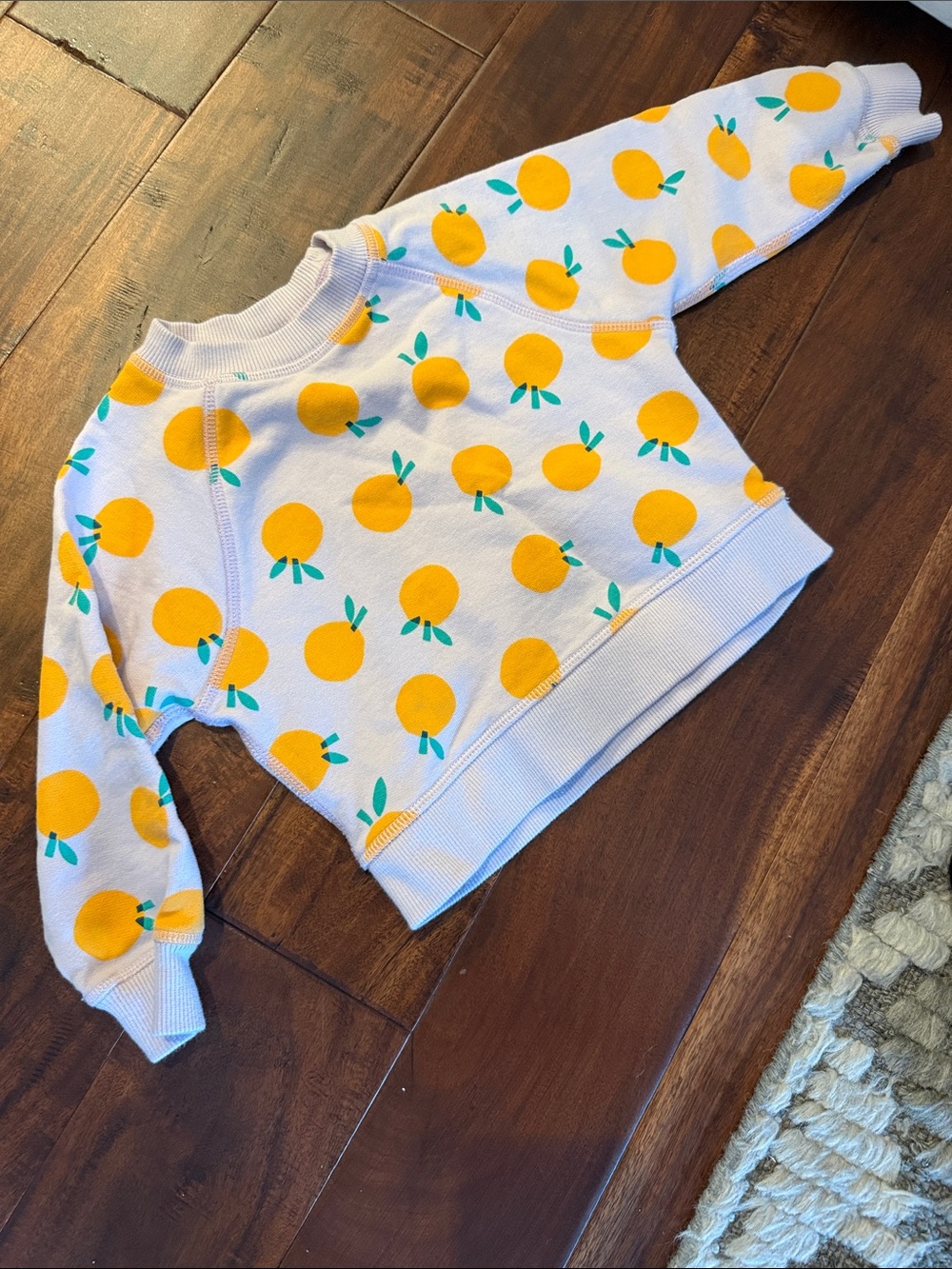 Hanna Andersson White Sweatshirt with Yellow Orange Motif and Teal Leaves